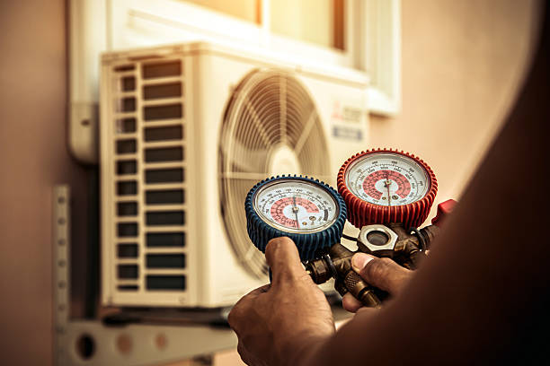 Professional Heat Pump Repair technician working in East Moriches, NY